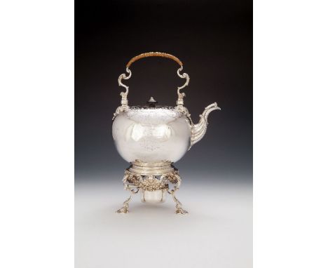 A late George III silver compressed spherical kettle on stand by Robert Garrard I, London 1815, with a wicker covered swing h