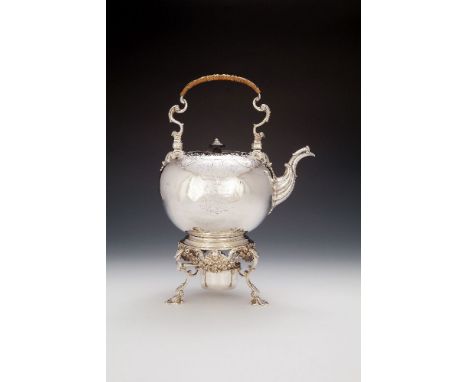 A late George III silver compressed spherical kettle on stand by Robert Garrard I, London 1815, with a wicker covered swing h