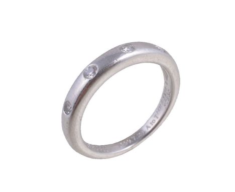 A diamond ring by Van Cleef &amp; Arpels, the band ring set with four brilliant cut diamonds in rubover settings, approximate