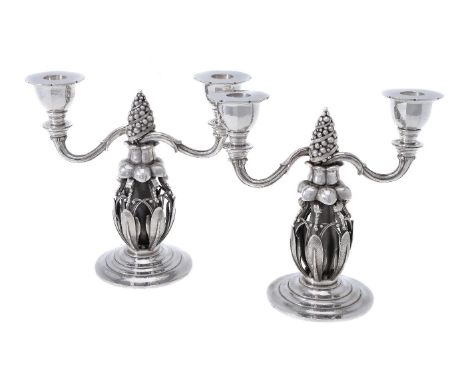 Georg Jensen, a pair of Danish silver Fir Cone twin light candelabra, post 1945 stamped marks, design no. 244, 21cm (8 1/4in)