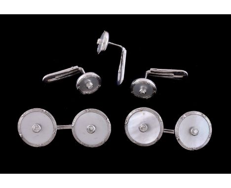 ϒA pair of mother of pearl and diamond cufflinks and three dress studs retailed by Theo Fennell, the cufflinks with circular 