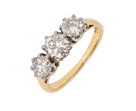 A diamond ring, with round brilliant cut diamonds, in gold, marked 18ct, 2.8g, size H  Several inclusions evident when examin