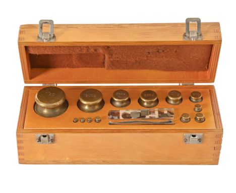 Scientific Instruments. A cased set of twenty weights, mid-late 20th c, comprising 1kg to 10mg, the box 28cm w  Good conditio