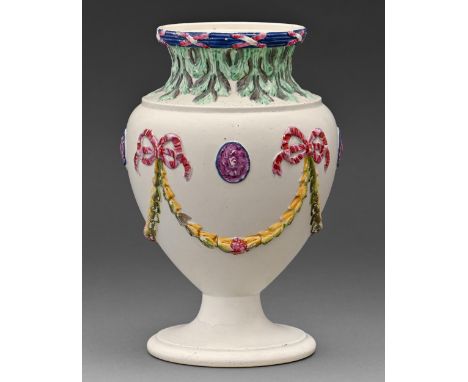 A Don Pottery neoclassical creamware vase, c1800, moulded with swags and paterae and enamelled in a bright palette, 19.5cm h,