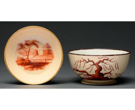 A Don Pottery Drabware slop basin and saucer, c1815, enamelled in fiery orange with a gnarled tree or country house, in brown