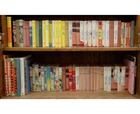 Children's Books. Four shelves, mid-20th c and later, including 1947 and later Rupert annuals, mixed bindings; Eagle Annuals;