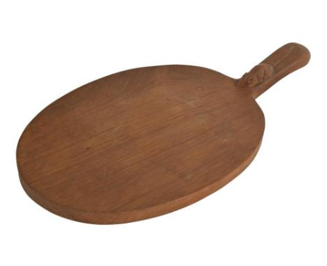 A Robert 'Mouseman' Thompson oak cheeseboard, c1980, 39.5cm l, carved mouse 'signature'  Bought new by the family of the pres