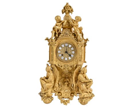 A French ormolu mantel clock, mid 19th c,&nbsp;in Troubadour style, the cast dial with enamel chapter plaques, the bell strik