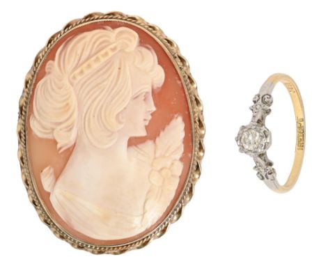 A cameo brooch, the oval shell carved with the head of a young woman, 9ct gold mount, 50mm, Birmingham 1973 and a diamond rin
