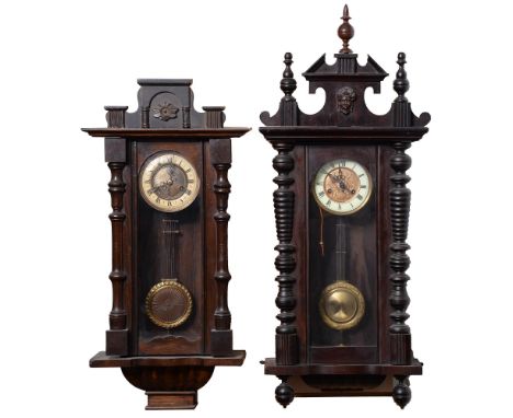 A stained wood Vienna wall clock, c1930, the giltmetal dial with primrose enamel chapter ring, pendulum and key, 75cm h and a