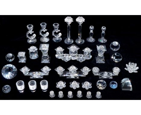 Swarovski. A collection of glass candle holders and paperweights, three glasses, stands and pens, boxed (approx 36)  Missing 