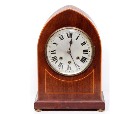 An inlaid mahogany arched top mantle clock, early 20th c, with silvered dial and brass bun feet, pendulum, 37cm h  