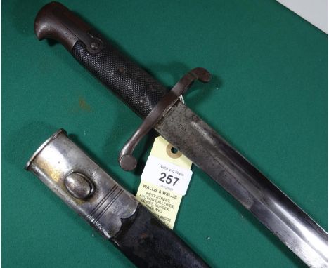 An 1856 Pattern Enfield yataghan bayonet, king’s head mark on blade, rack number to pommel, black chequered leather grip. In 