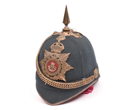 A scarce post 1902 officer’s green cloth home service helmet of the 3rd Royal Jersey Light Infantry Militia, gilding on HP an
