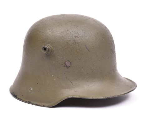 A WWI Imperial German Army steel helmet, GC (replacement lining and old repaint) £100-120.