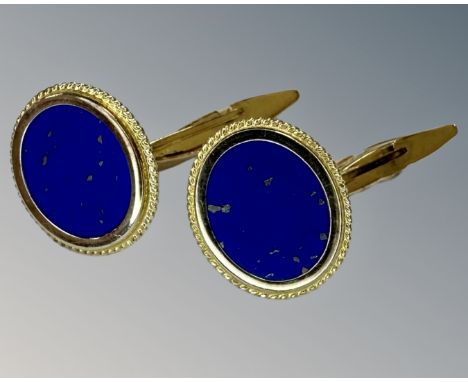 A pair of lapis lazuli cufflinks set in 14ct yellow gold.