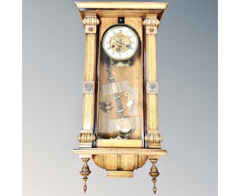 An inlaid eight day wall clock with enamel dial 