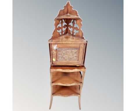 A stained pine fretwork corner wall shelf cabinet together with a mahogany three tier curio table 