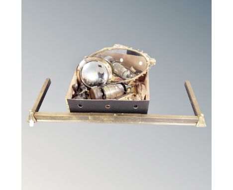 A bras extending fire curb and a box of Tilley lamp, brass framed porthole mirror, mirror, etc 