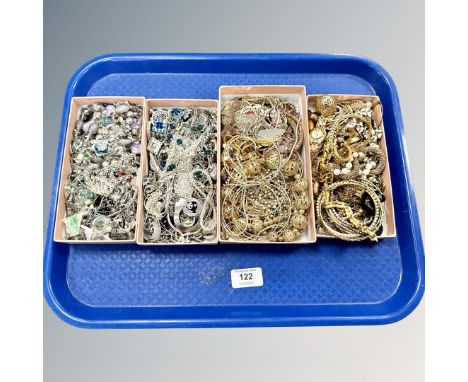 A tray of silver tone and gold tone costume jewellery