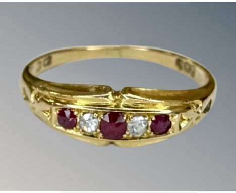 An 18ct gold ruby and diamond ring, size L½.