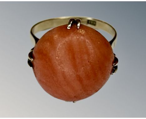 A yellow gold coral ring, size K, shank stamped 18k.