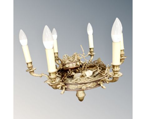 A 20th century continental brass six-way light fitting. 