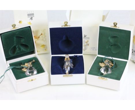 Three boxed Swarovski Christmas Memories to include 1998 Angel with Harp, 1997 Angel with horn and Angel