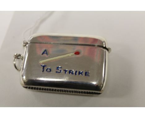 Silver vesta case with enamel image of a match to the case