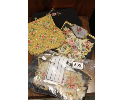 A group of vintage embroidered purses