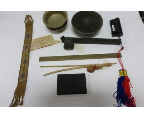 A Tibetan tea bowl, a persian scribes travelling inkwell and pen holder, similar measure and stone book etc.