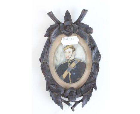 19th century miniature portrait of a soldier in a black forest frame