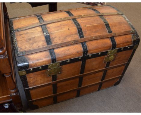 Late 19th century stained wood travelling trunk with metal and wood lath mounts to the domed lid and frame, two metal locks, 