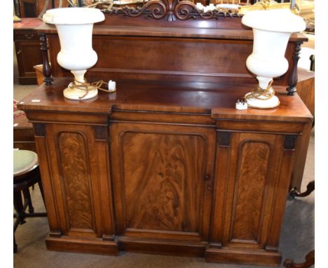 19th century mahogany break front sideboard, scroll moulded pediment over a shelf supported by moulded columns, the lower sec