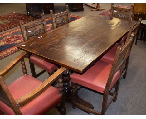 20th century small oak refectory style dining table with panelled top, turned baluster end supports, shaped ends and cross-st