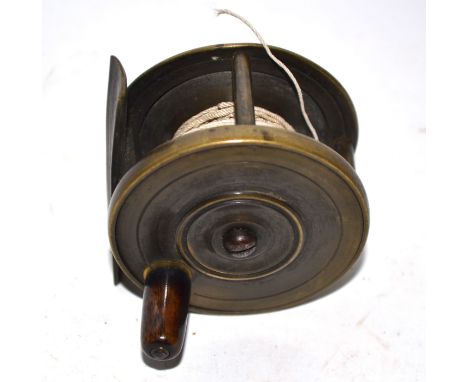 Two small vintage brass fishing reels, both approx 6cm diam (2)   