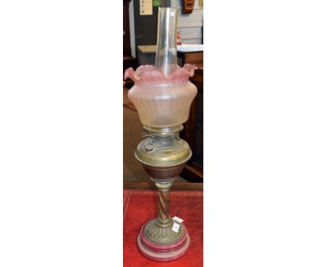 Late Victorian pink ceramic based/brass oil lamp with barley twist column, plain font and replacement pink tinged opaque glas