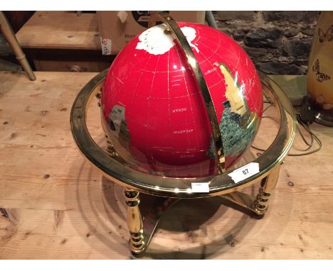 A large World Globe, red.