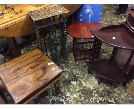 A wrought iron and wicker cd rack an Indian hardwood coffee table  small wooden magazine rack and a corner whatnot.