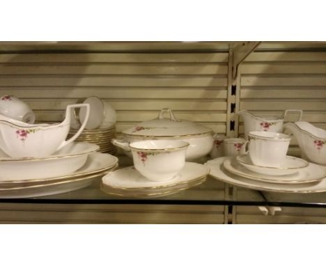 A Spode dinner service that will serve 15. Includes 3 coffee pots and 3 serving bowls, and a set of 12 cups and saucers.