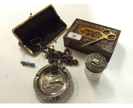 A small marquetry box a ladies purse a looking glass with beaded neck piece a small white metal and enamel brooch a German wh