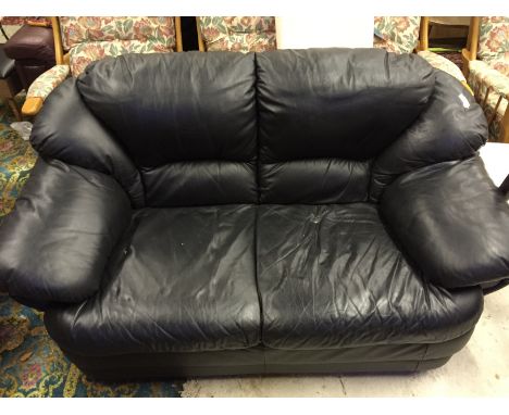 A good condition black leather two seater sofa.