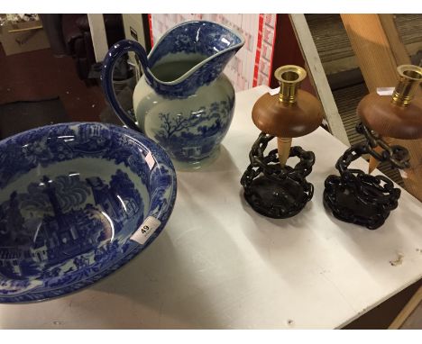 A blue and white Jug and bowl, a pair of candlesticks and a brass and a blue porcelain lamp base. 