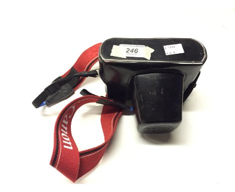 A cased Zenit E camera.
