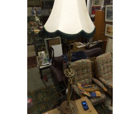 A brass standard lamp.