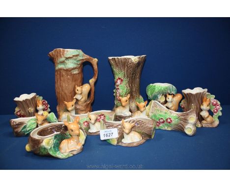 Ten pieces of Hornsea china including tree trunk vases, jug and posy vases