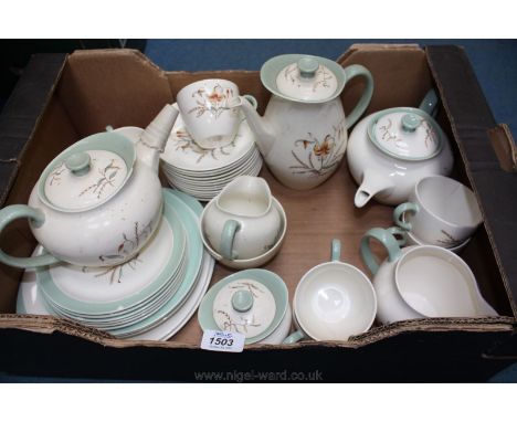 A quantity of Wedgwood tableware in Tiger Lily pattern including Teapot, Coffee pot, cream jug, milk jug, sugar bowls, plates