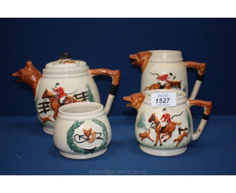 A PPC four piece Teaset having fox head spout and tail handles and hunting scenes.