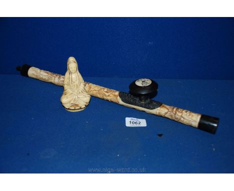 A modern carved bone Opium Pipe and a model of a seated Buddha