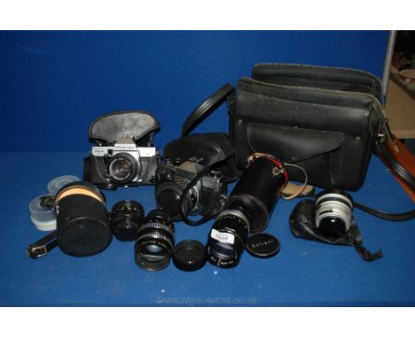 A quantity of camera equipment including two Praktica MTL 5 cameras, a Soligor tele-auto 135mm lens, an Orestor 135 lens, Pen